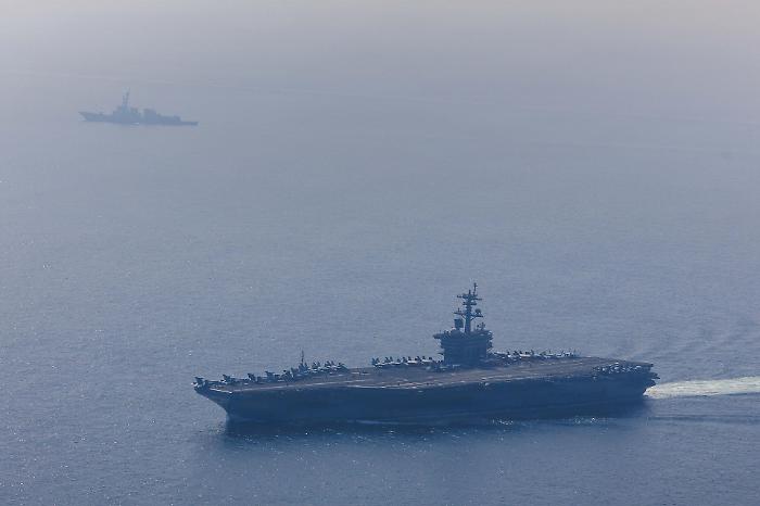 Iran launches cruise missiles at the USS Abraham Lincoln aircraft carrier and threatens new attacks.